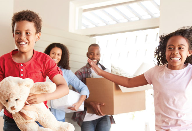 A family with two children, a mother, and a father moving into a new home.