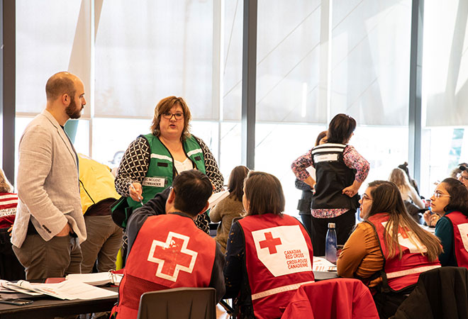 Photo of Halton Region Children Services Supervisor and Canadian Red Cross volunteers.